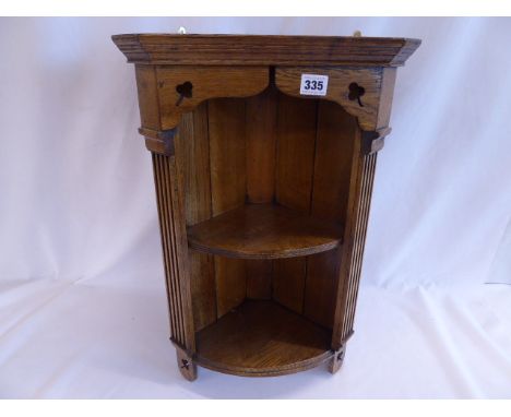 Small oak hanging corner shelf with clover detail 