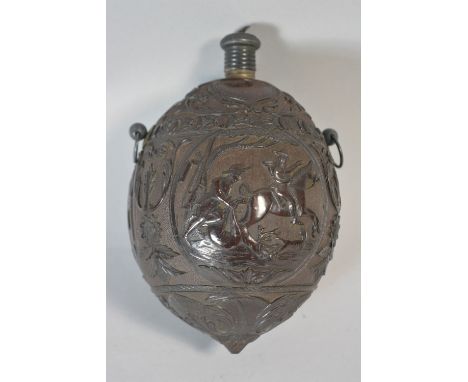 An Early 19th Century Carved Coconut Bugbear Powder Flask Decorated in Relief with Three Cartouches - Hunters Taking Boar and