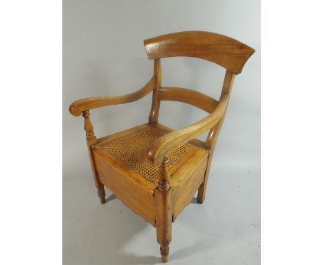A Late Victorian Satin walnut Commode Armchair with Cane Seat