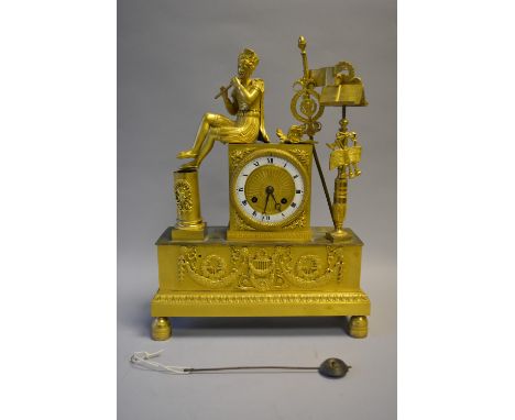 A French Gilt Figural Mantel Clock in the Second Empire Style with Seated Musician Playing Flute, Music Stand and Other Music