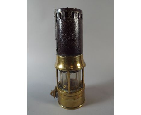 A Richard Johnson Clapham and Morris Miner's Safety Lamp in Brass and Iron, The Marsaut