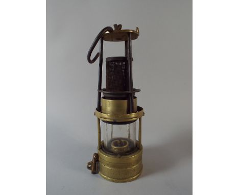 A Brass Miner's Safety Lamp by Richard Johnson Clapham and Morris, Manchester