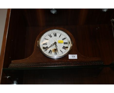 AN OAK NAPOLEON HAT MANTLE CLOCK