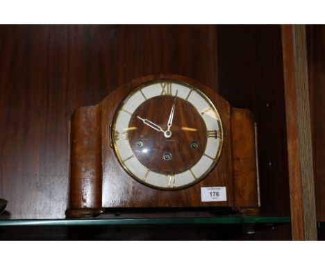 AN OAK MANTLE CLOCK