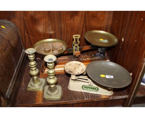 TWO SETS OF SCALES AND WEIGHTS AND TWO BRASS CANDLESTICKS