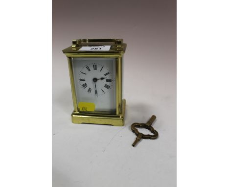 A BRASS CARRIAGE CLOCK WITH KEY