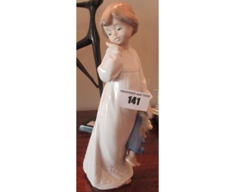 A Nao Figure of a Young Girl Holding a Teddy.