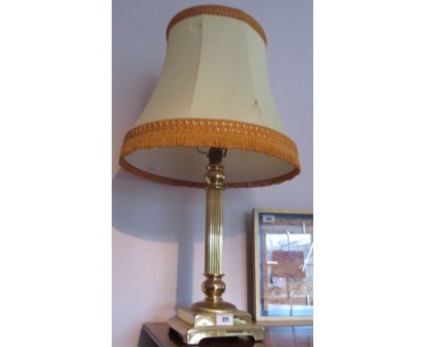 A Brass Table Lamp with reeded columnar support on a square stepped base, with shade.