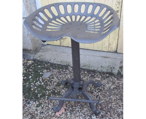 A Cast Iron Tractor Seat Stool