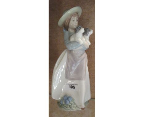 A Nao Figure of a Girl Holding Puppies.