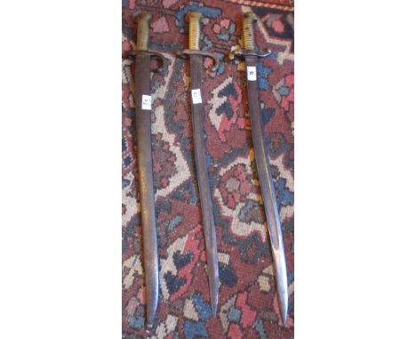 Three 19th Century Bayonets, one with scabbard and hanger (3).