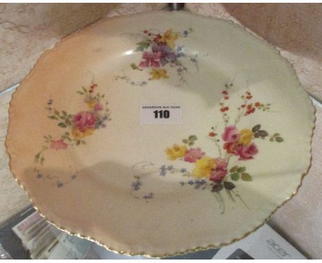 A Royal Worcester Blush Ivory Plate with painted floral sprays and puce printed mark to reverse.