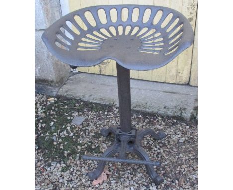 A Cast Iron Tractor Seat Stool
