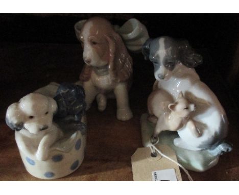 Three Nao Figures of Puppies.