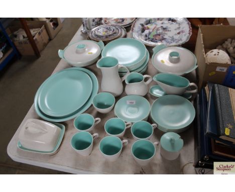 A collection of Poole pottery twin tone tea and dinnerware