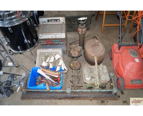 Two shop scales with some weights; a printing press; a swing handled pot; a hand pump and fire curb etc