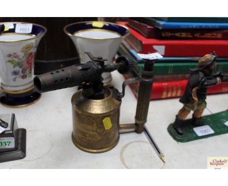 A brass blow lamp