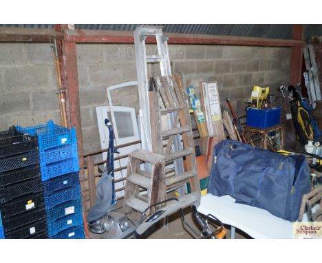 A wooden step ladder; a small set of wooden steps and an aluminium step ladder
