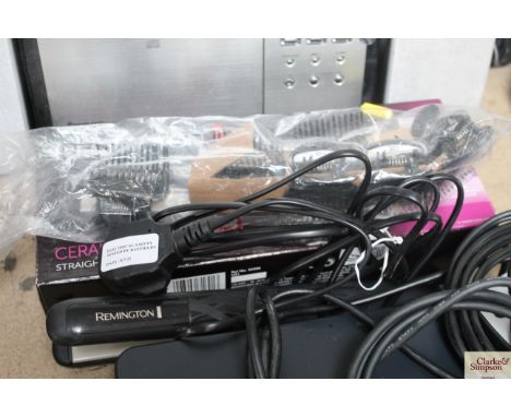 A pair of Remington ceramic straighteners