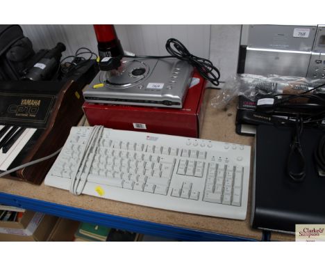 A Duraband compact DVD player and tiny computer keyboard