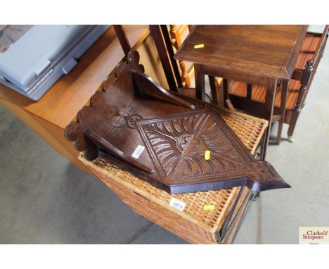 A carved oak wall bracket