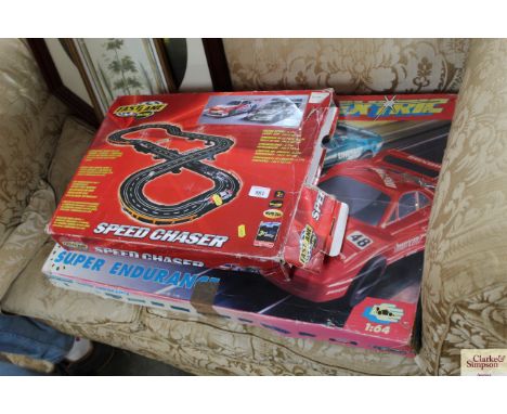 A Micro Scalextric set and a Fast Lane slot car racing game