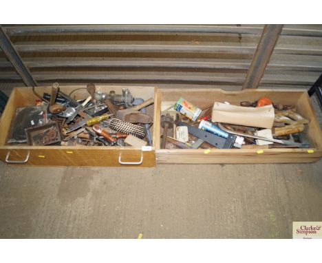 Two wooden drawers containing various tools 