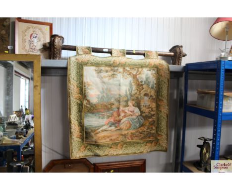 A wool tapestry on a carved oak rail