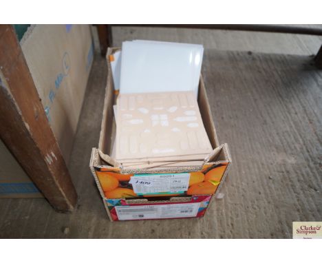 A small quantity of white ceramic wall tiles 