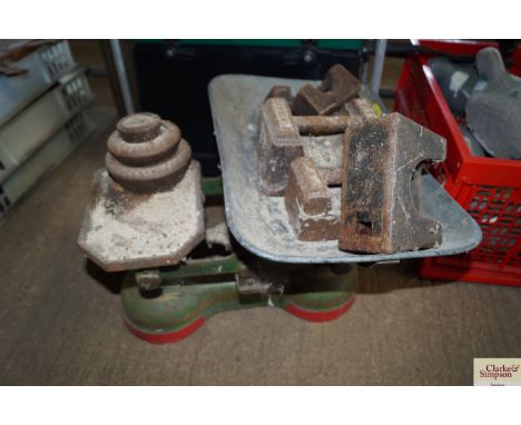 A pair of scales and various weights 