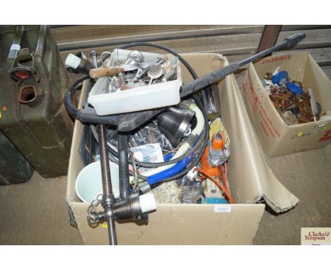 A hand held drill adapted to a metal base to form a grinder; a two branch ceiling light; pressure washer hose; tray of variou