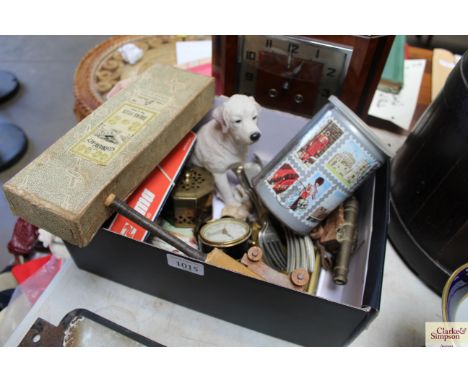 A box containing miniature England 1957 cricket bat; brass model canons; clock; railway carriage etc