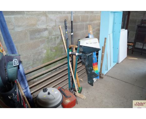 A quantity of long handled gardening tools and a metal fuel can