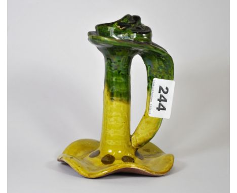A signed Arts &amp; Crafts glazed pottery chamber stick, H. 15cm.