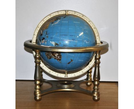 A polished stone inset globe, Dia 33cm (frame).