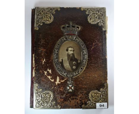 A rare 19th century white metal mounted leather desk blotter containing a monochrome portrait of King Leopold II of The Belgi