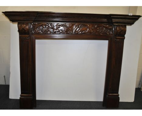 A carved mahogany fireplace surround, W. 160cm (overall).