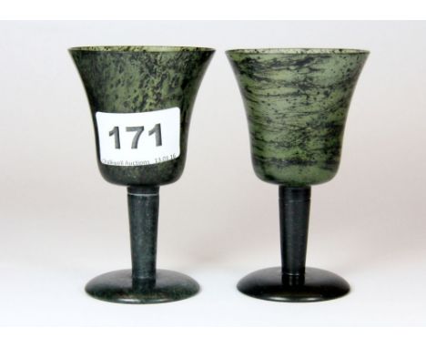 A pair of polished spinach jade wine cups, H. 10cm.