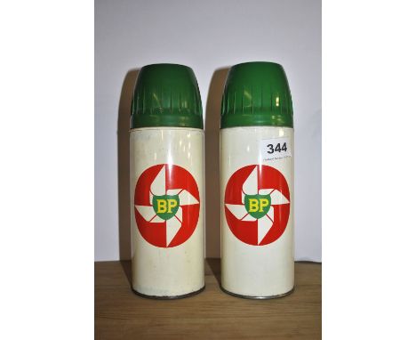 Two vintage BP thermos flasks.