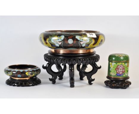 A Chinese early 20th century cloisonne on copper dragon bowl with hardwood stand (Dia. 26cm, H.21cm with stand), together wit
