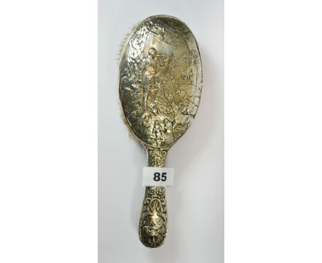 A silver backed hunting scene hairbrush, L. 25cm, Hallmarked for Chester, 1901, made by William Aitken (Registered 1899).