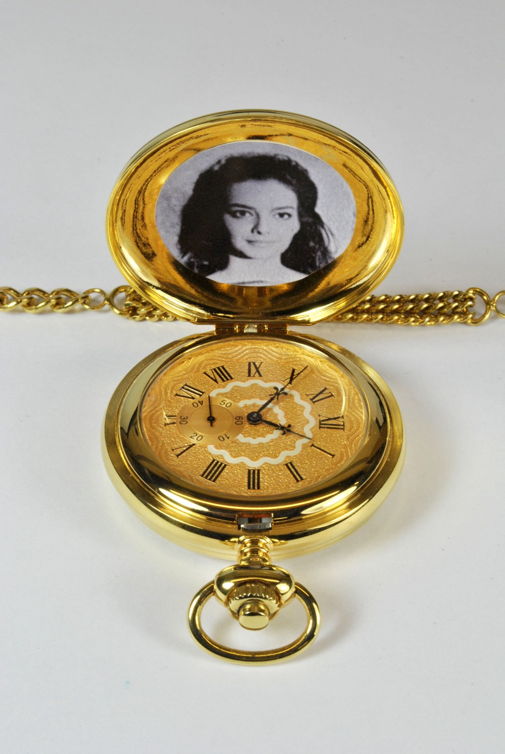 A novelty gold plated musical pocket watch, from the Clint Eastwood ...