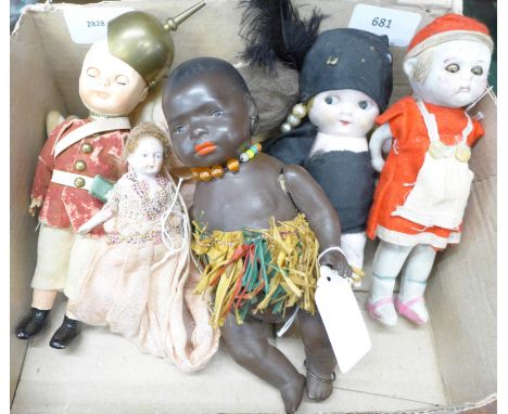 A collection of seven dolls, including Heubach Koppelsdorf, one with sleeping eyes with squeaker in body and bisque head