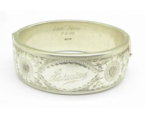 A silver bangle, engraved, 61.7g