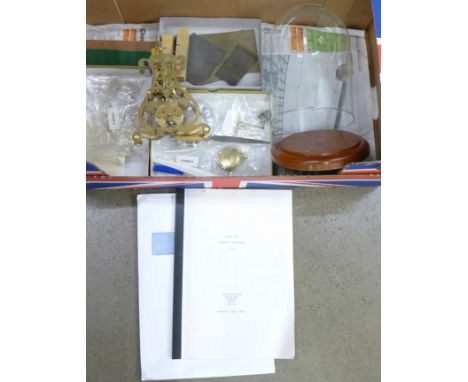 A skeleton clock kit, partially assembled, requires completing, with glass dome