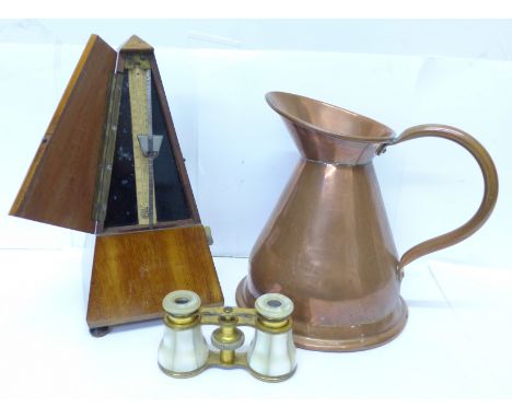 A Maelzel Paris metronome, a pair of mother of pearl mounted binoculars and a brass jug