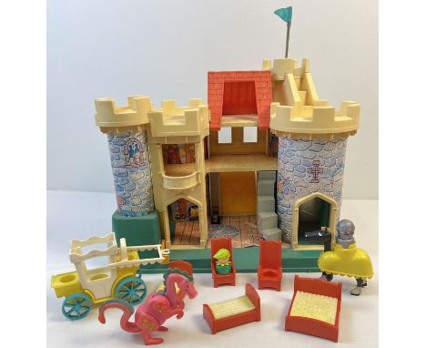 A vintage Fisher Price Castle play set with figures and accessories to include a horse with knight and a dragon. Sun fading t
