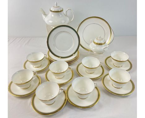 A quantity of Royal Doulton Georgian shape tea ware in classic 'Clarendon' pattern, with gilt detail. Comprising: teapot, 8 x