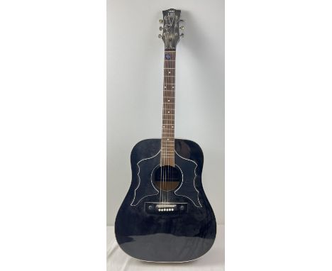An Eros 906 Raven acoustic guitar in black finish. Model No. 1519. Small split to veneer on base. Approx. 107cm long. 