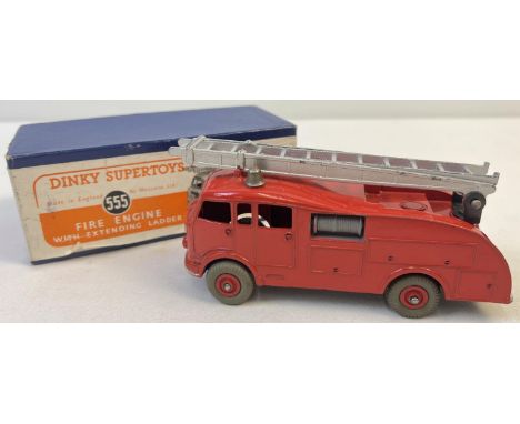 A boxed Dinky Supertoys Fire Engine with extending ladder #555, in very good original condition. In an early blue box with or